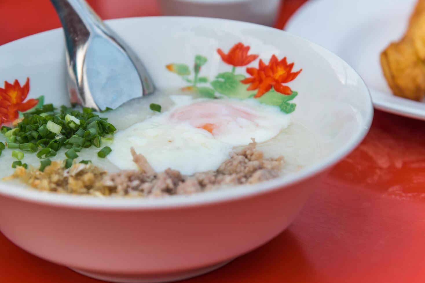 A bowl of food with a spoon photo
