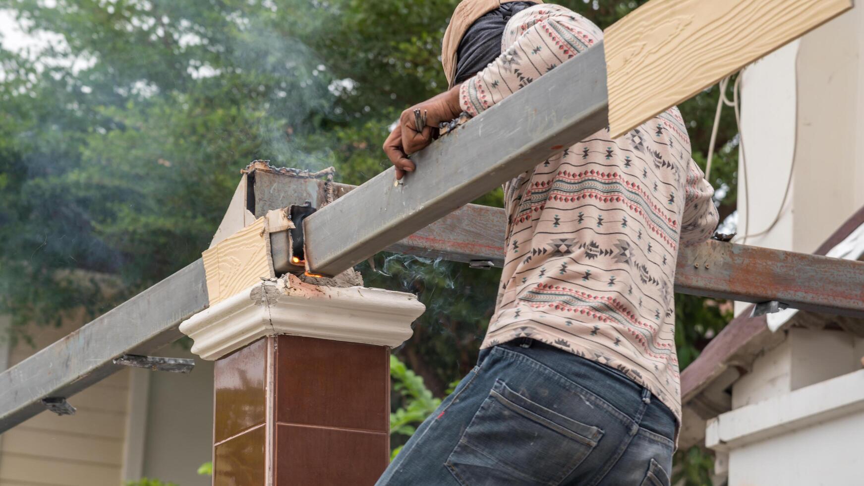A man is working on a building photo