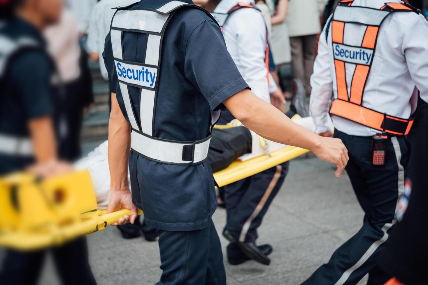 A group of people walking with a stretcher photo