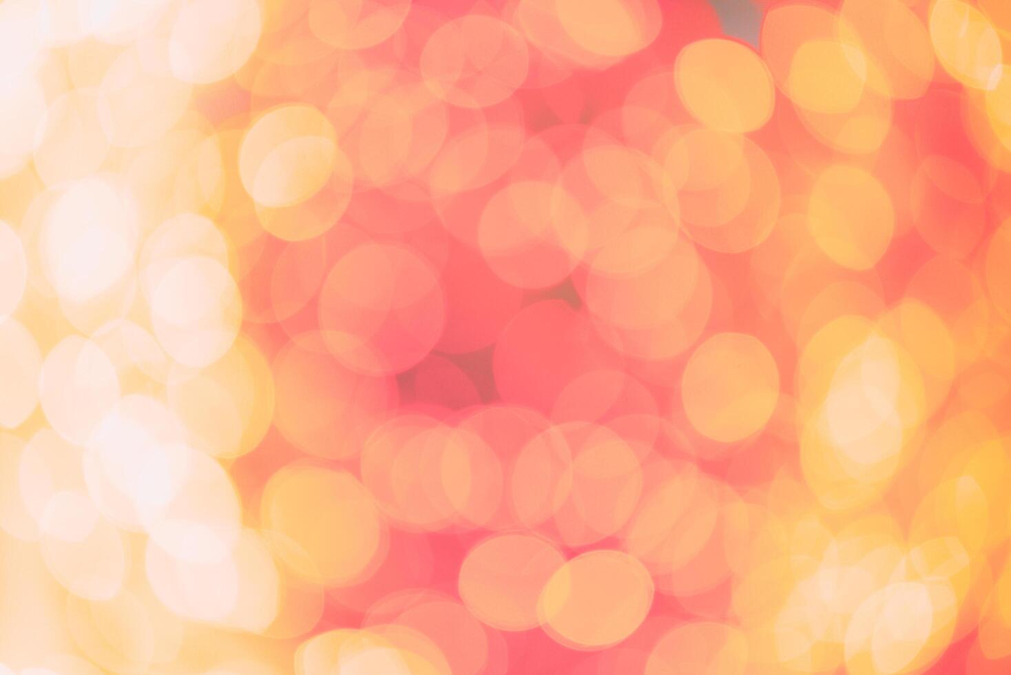 A red and yellow background with blurry lights photo