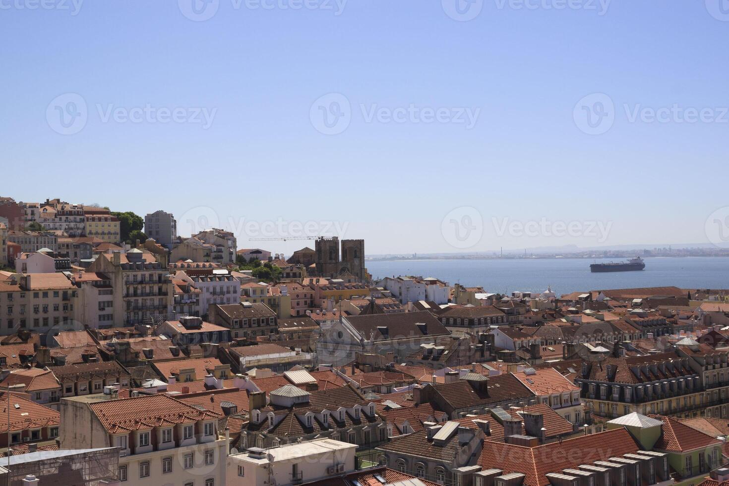 The view of the city from view point. The roofs of the houses and the river. Lisbon, Portugal. photo