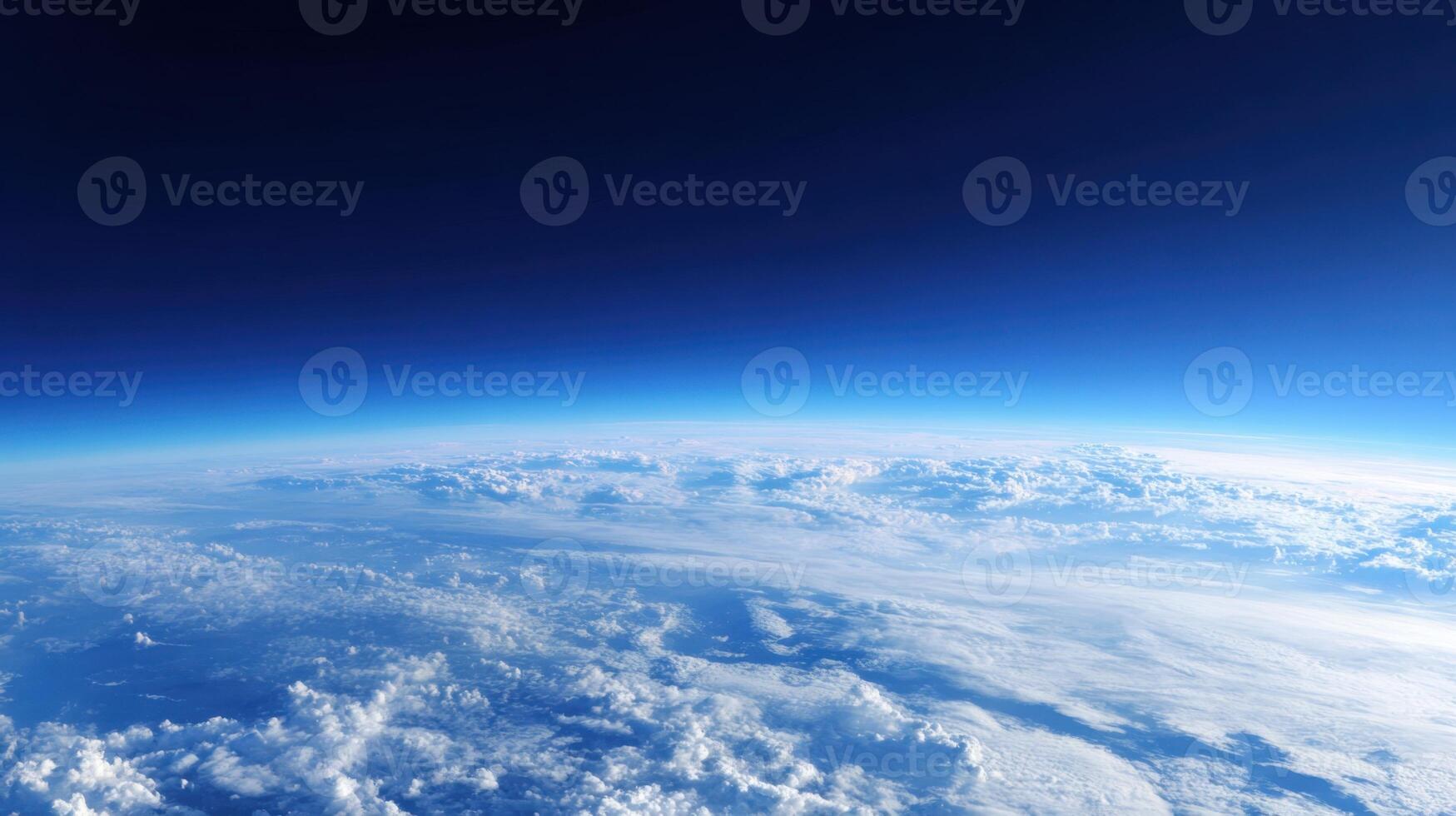 Panoramic view from high altitude showcasing the Earth's curvature, atmospheric layers and cloud formations. photo