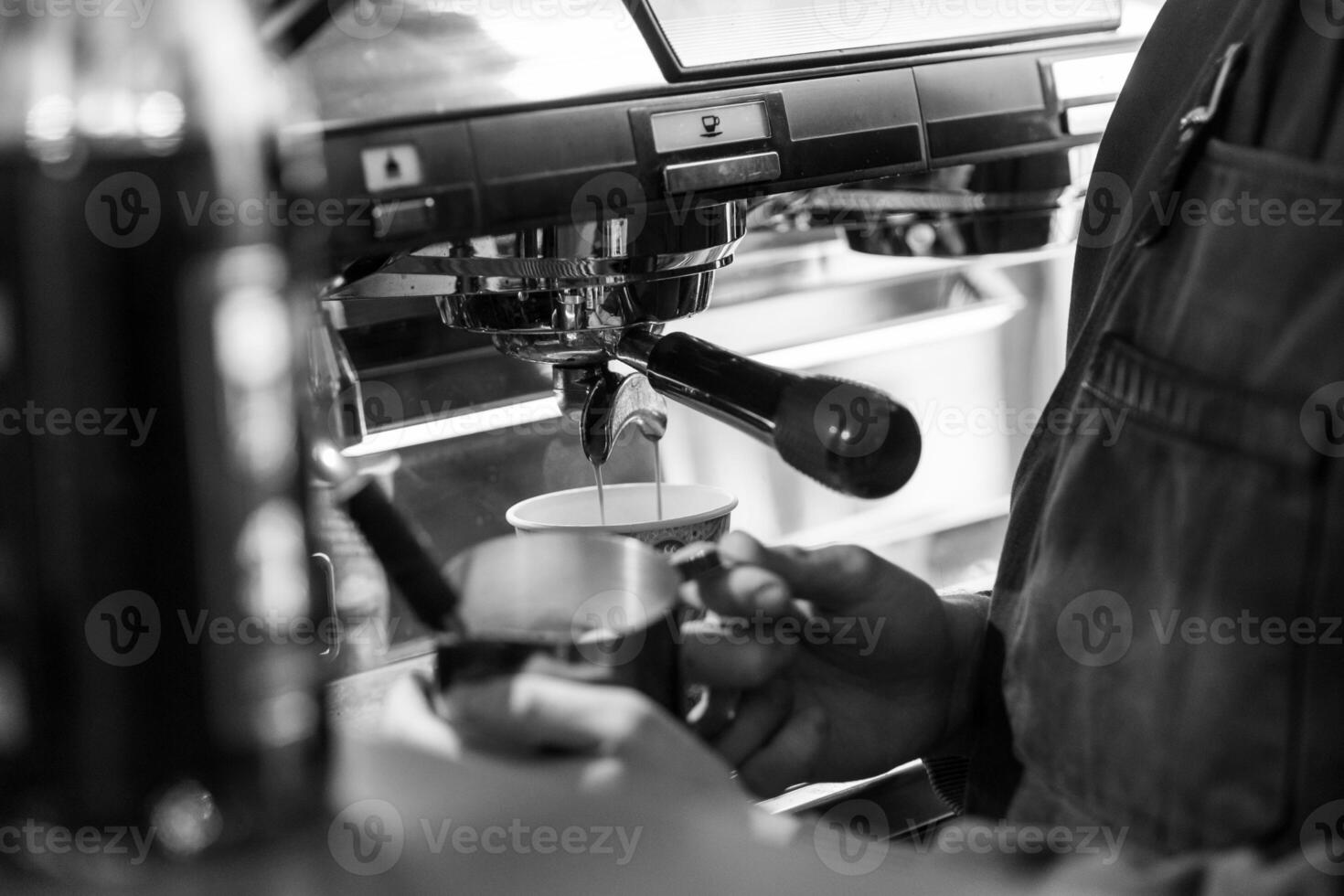 Brewing Coffee at a Cafe With a Barista Making Espresso in a Charming Atmosphere During the Morning Rush photo