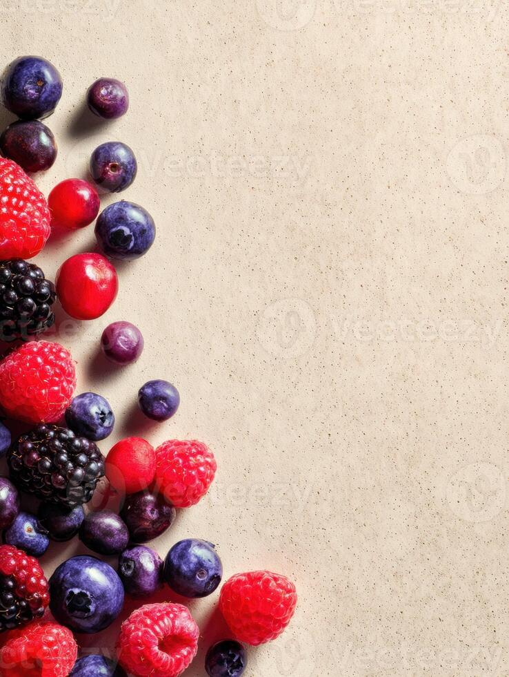 Mixed Berries Arranged on a Textured Paper Background With Soft Shadows Creating a Vibrant and Fresh Appearance photo