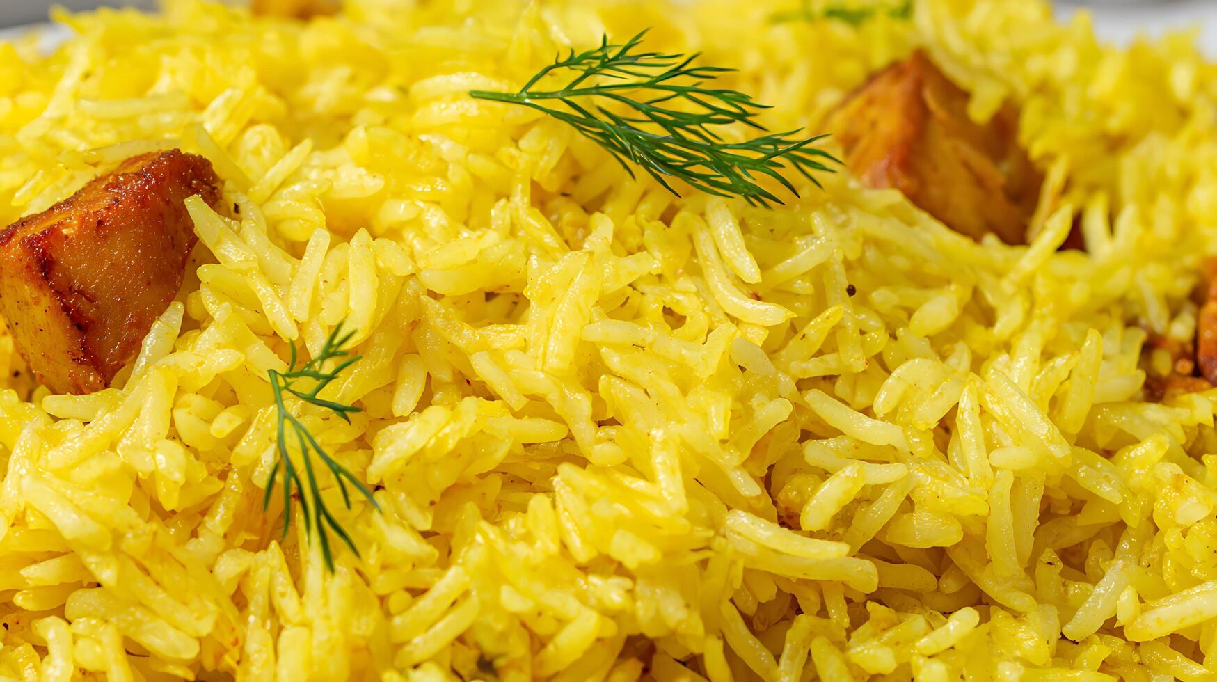 Close up of appetizing yellow rice with meat and fresh dill. photo