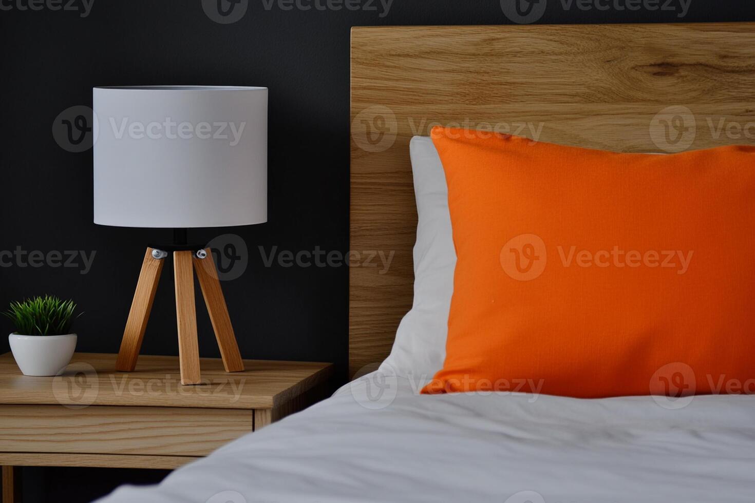 A white bed with a white pillow photo