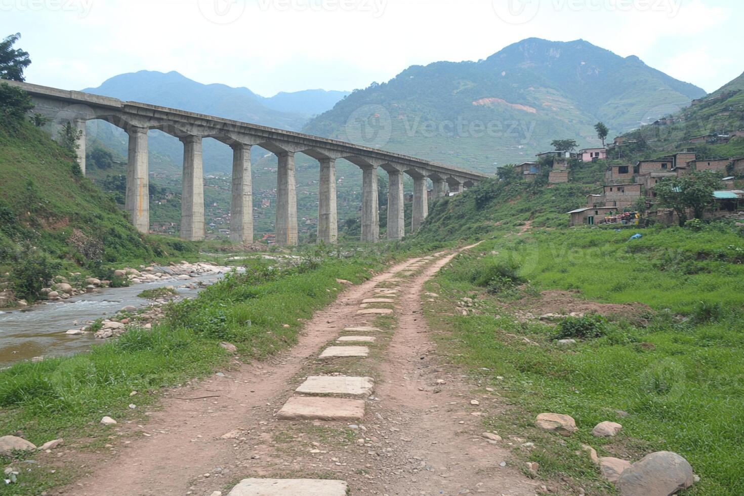 A bridge over a river with a train on it photo