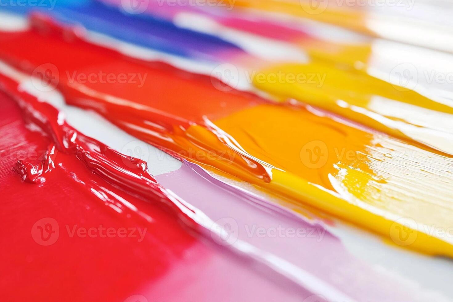 A close up of a paint brush with many colors photo