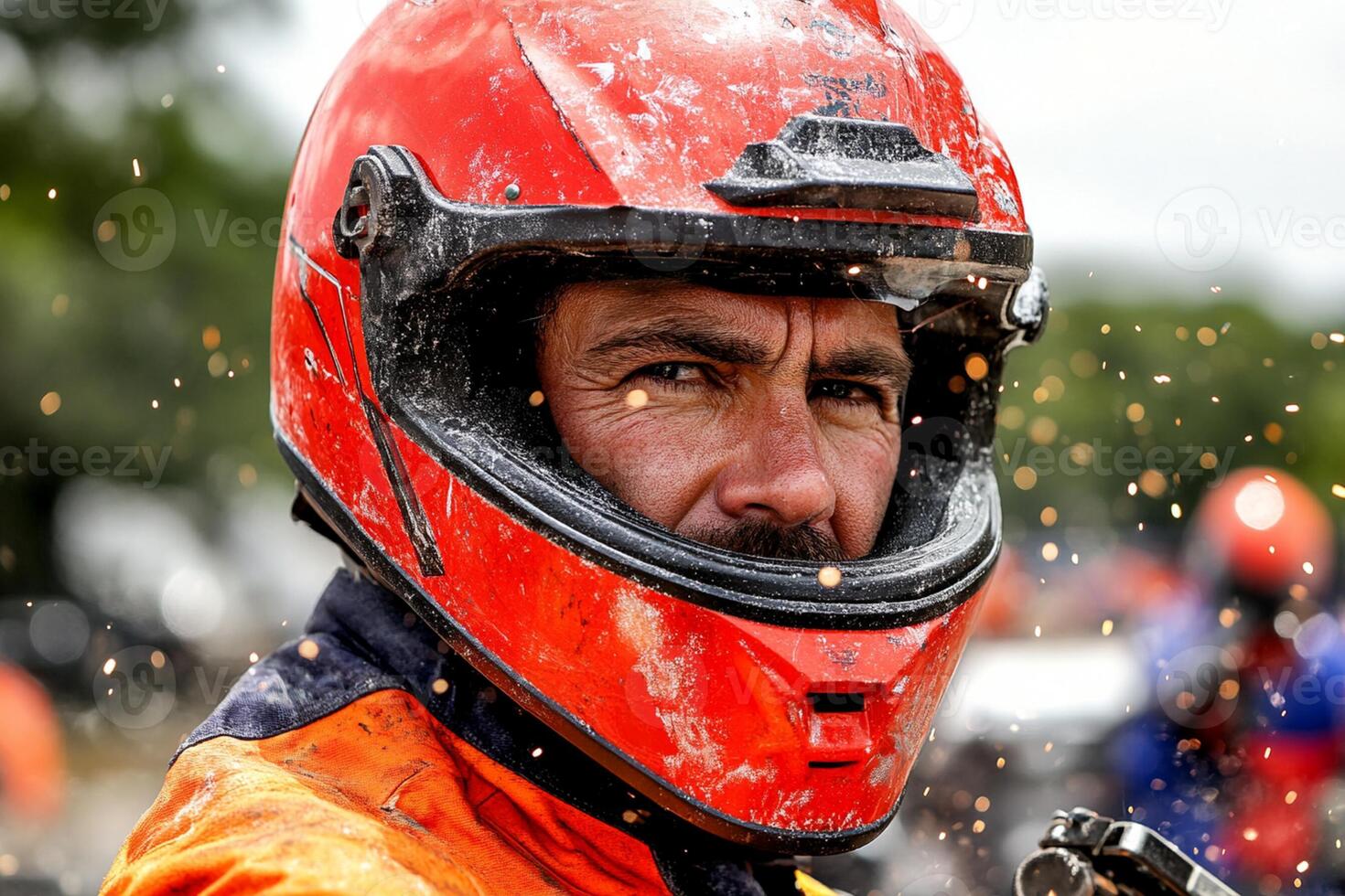 A man wearing a helmet and a red jacket photo