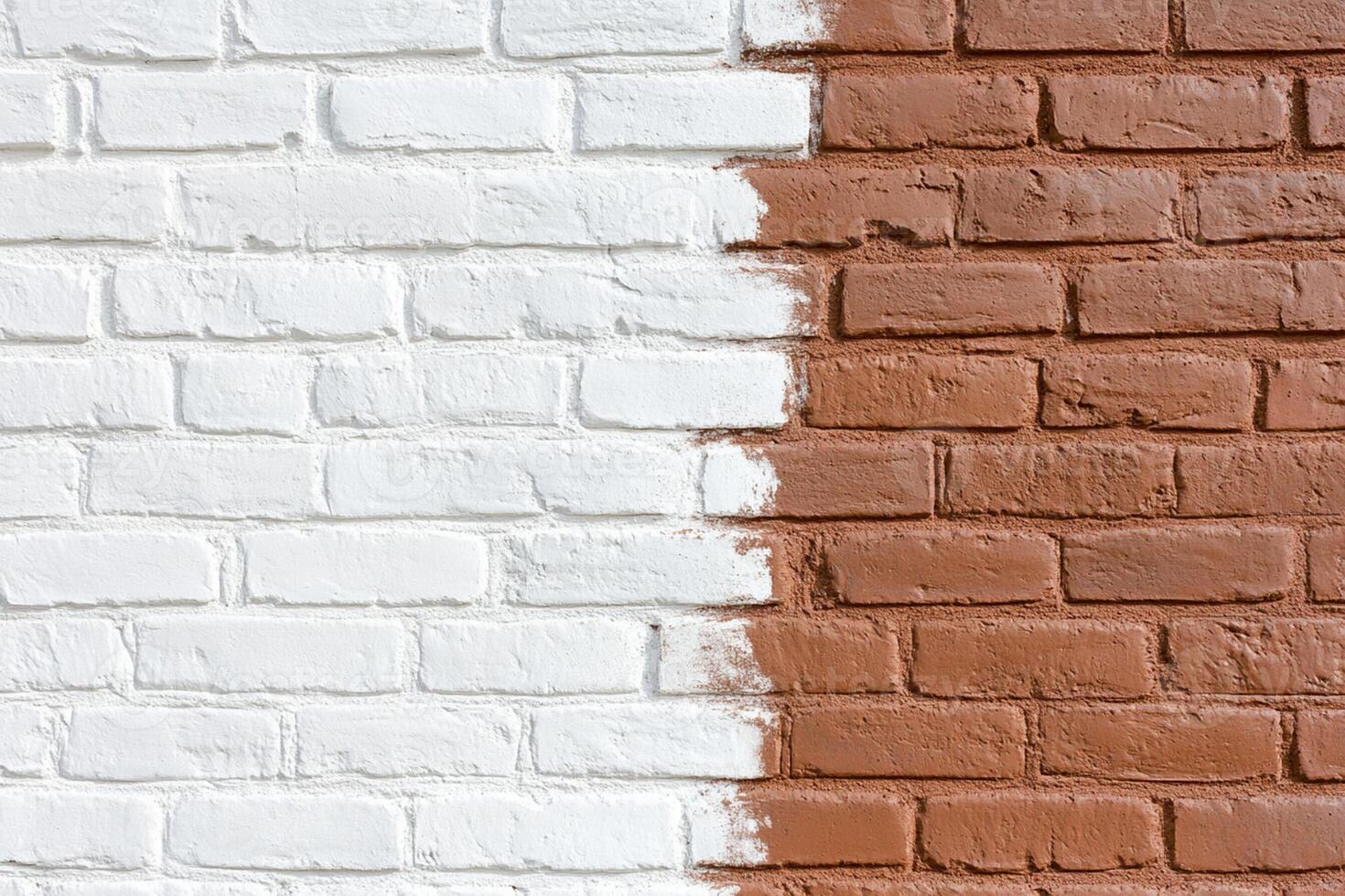 A white and brown brick wall with paint on it photo