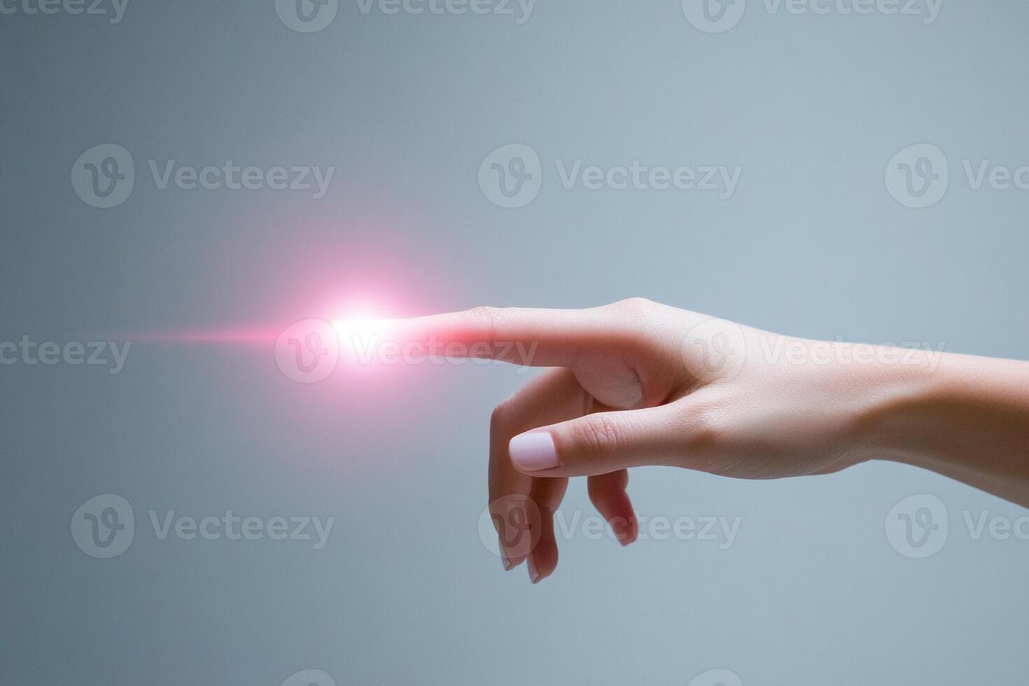 A person's hand is holding a glowing object photo