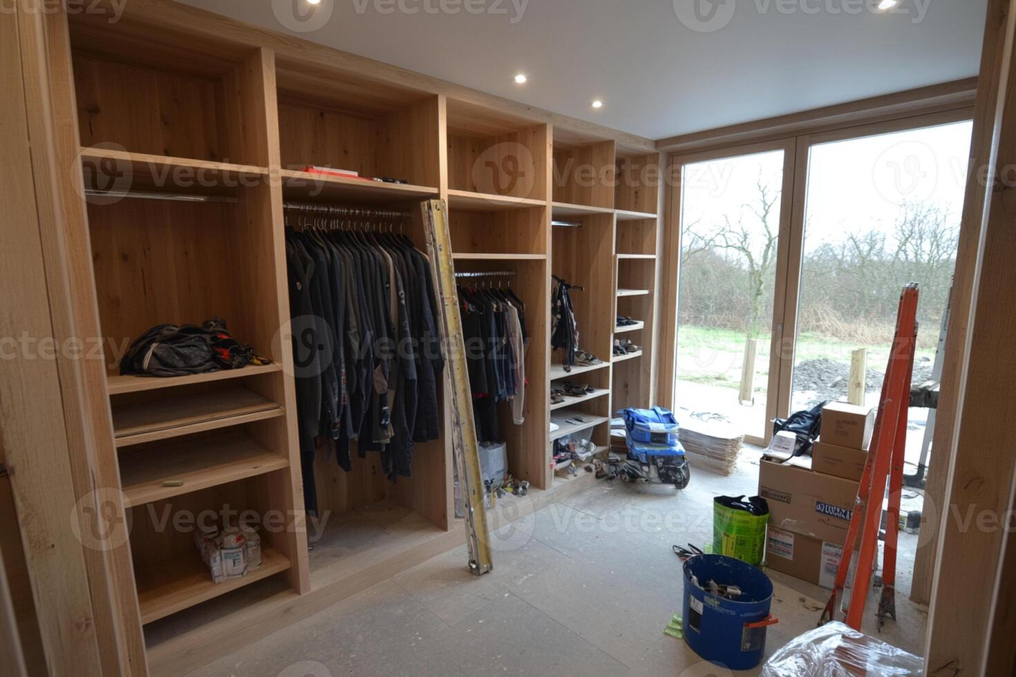 A closet with a wooden door and shelves photo