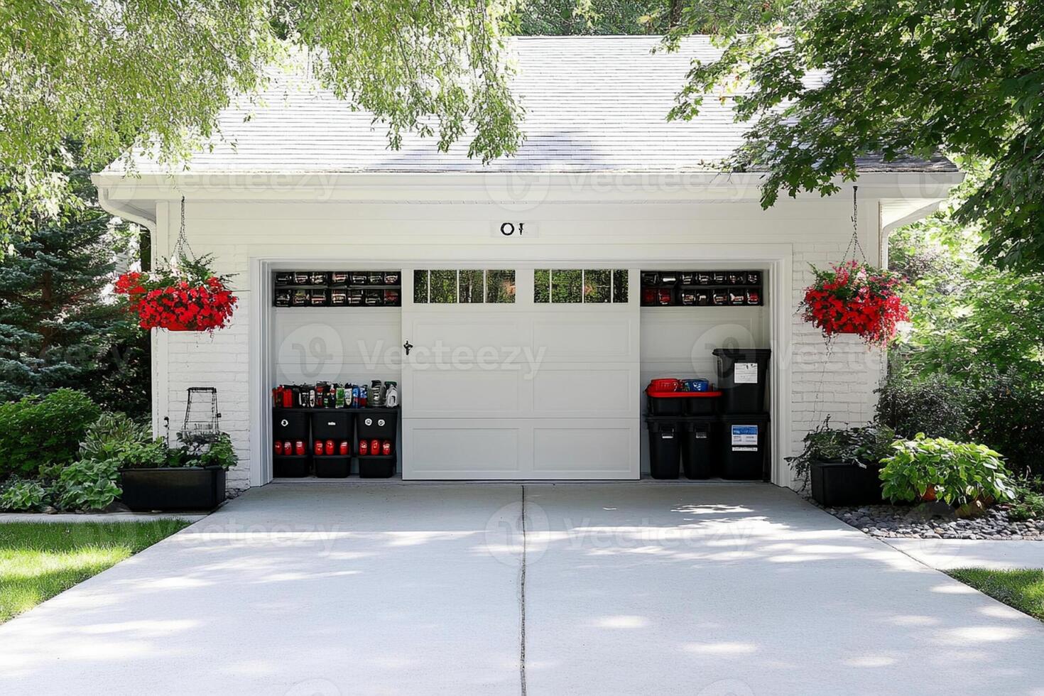 A garage with a large white door and a large basket of flowers photo