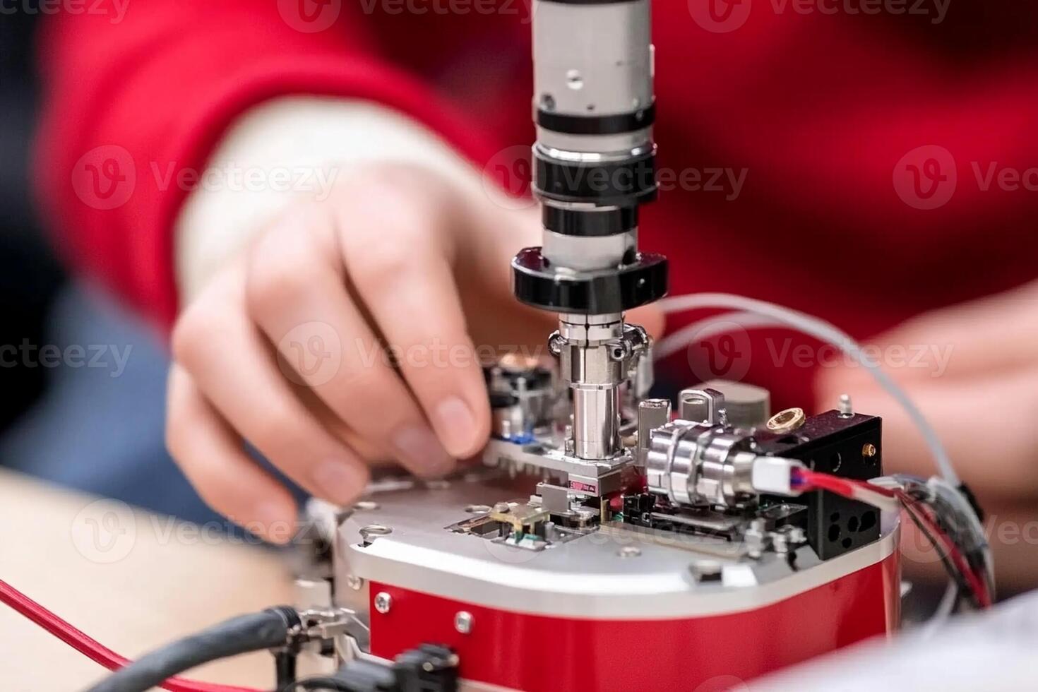 A person is working on a small device photo