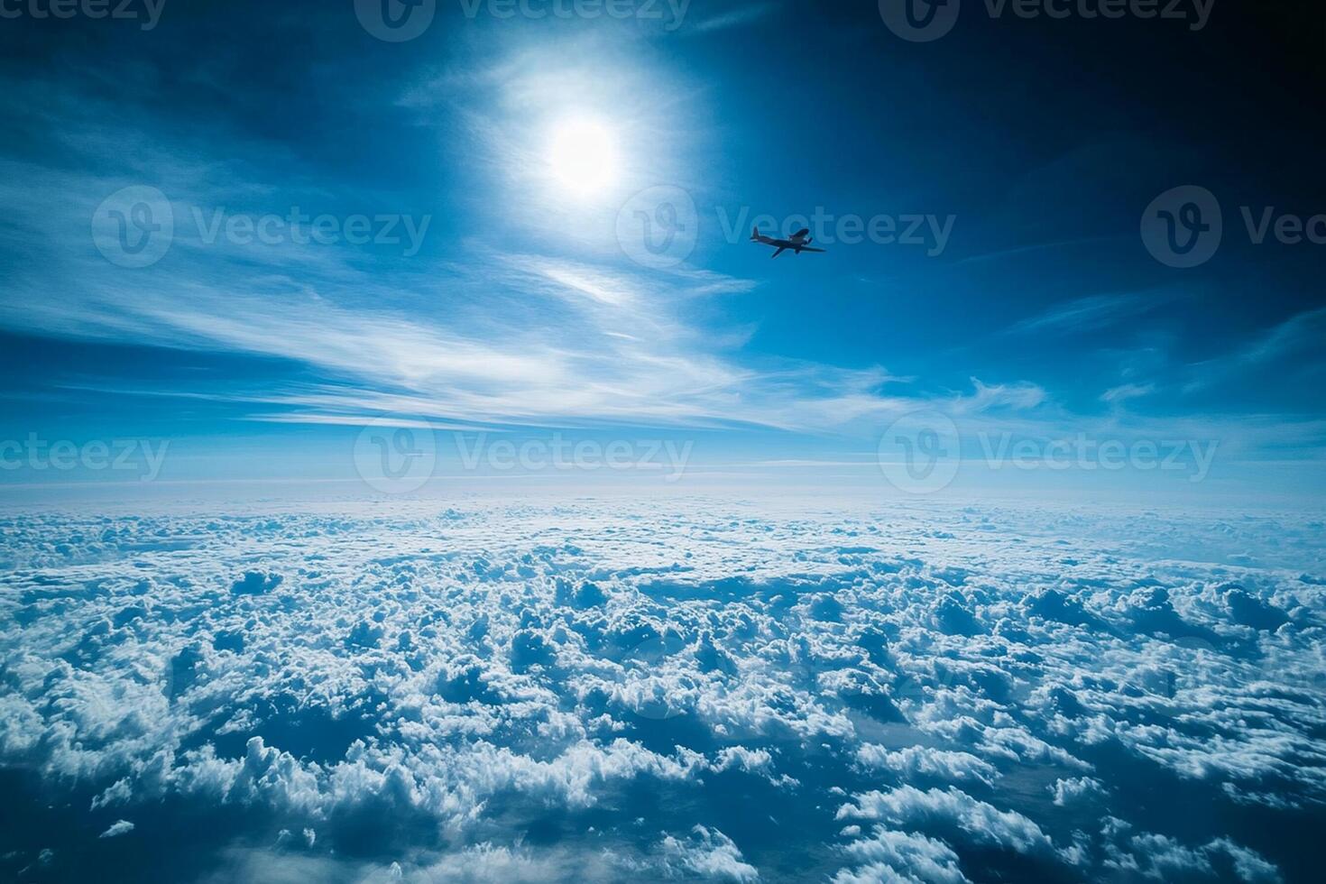 A plane flying over the clouds photo