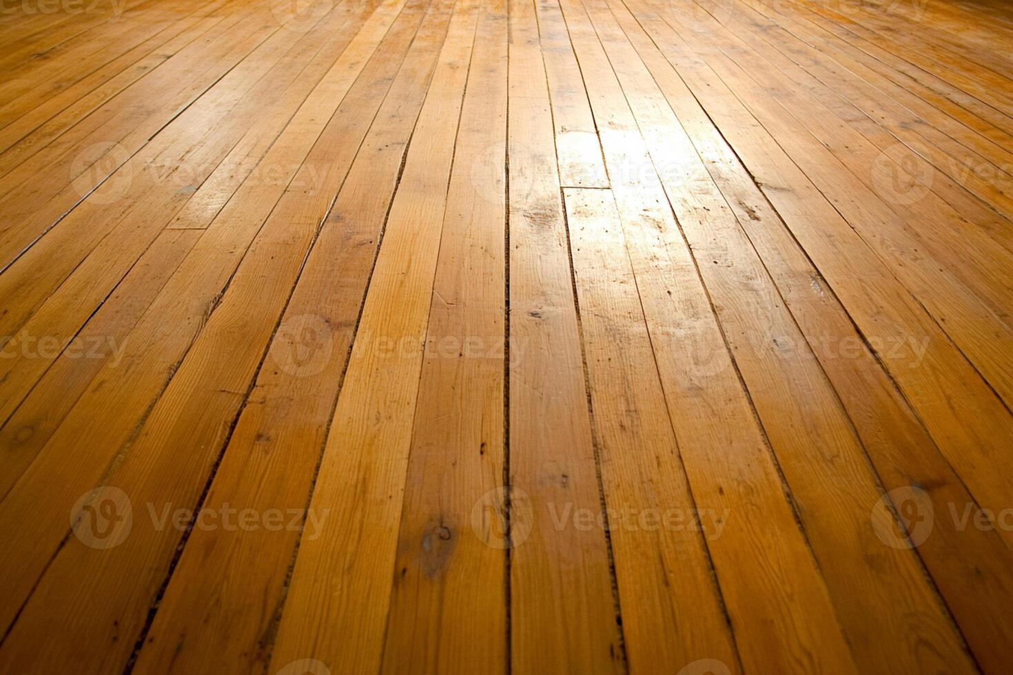 A wooden floor with a light shining on it photo