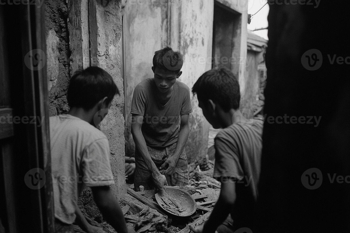 Three boys are working on a pile of wood photo