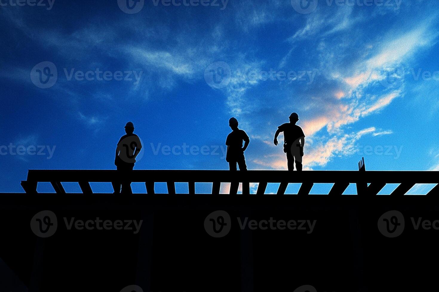 Three men standing on a wooden platform with a blue sky photo