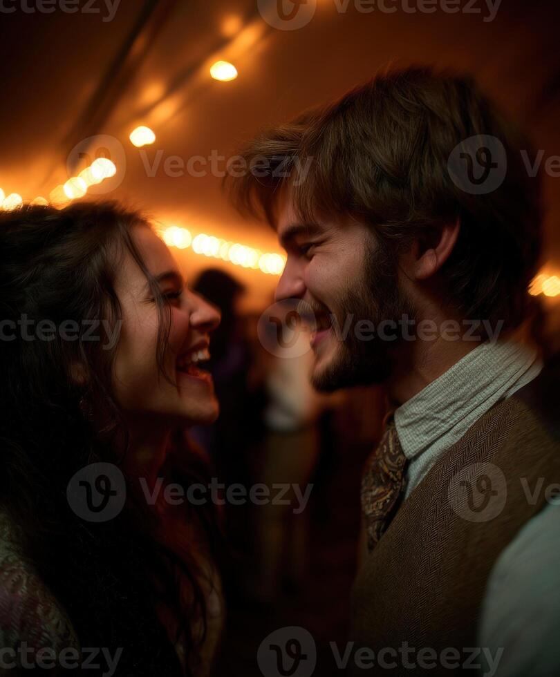 Young couple laughs face to face at evening celebration photo
