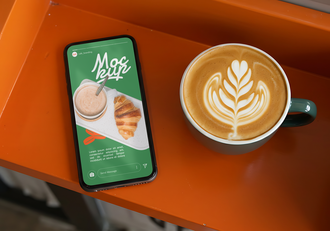 A smartphone displays a cafe menu featuring a croissant and a creamy beverage alongside a cup of latte art psd
