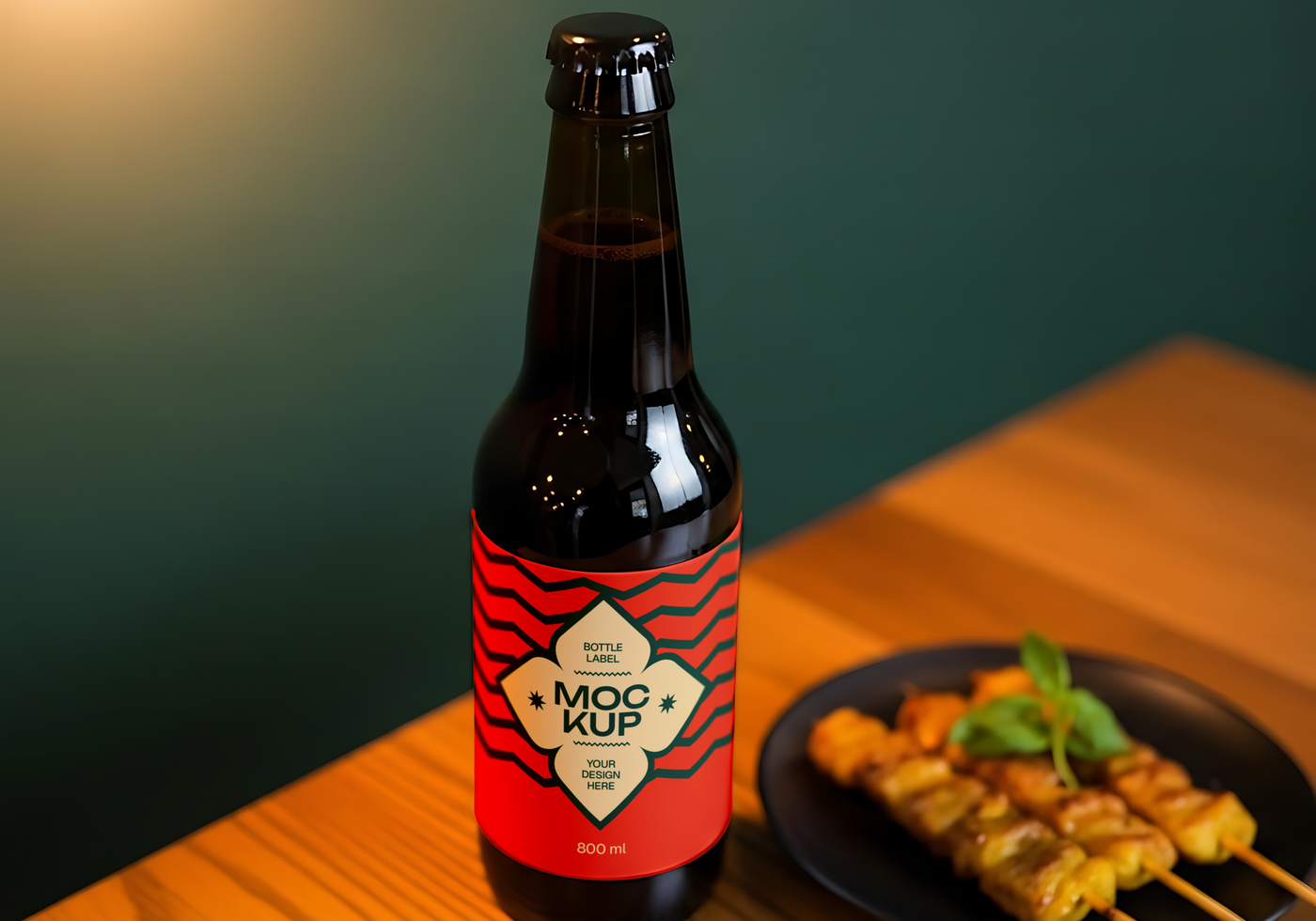 A bottle of beer with a red and black label sits on a table next to a plate of satay psd
