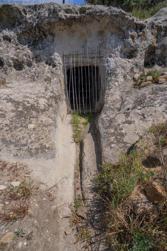 Sacred Domus de Janas Carved into Cliffside in Italy photo