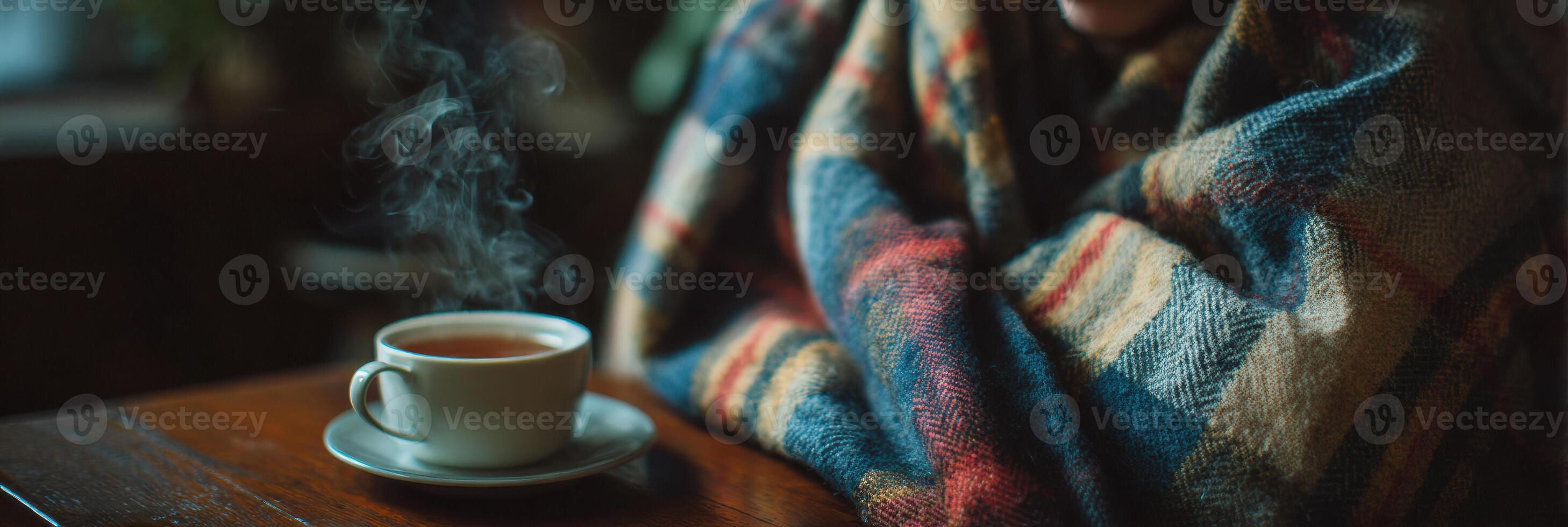 Wrapped in Warmth, a Sick Person Quietly Enjoys Tea on a Cold Day With an Empty Space to the Left for Comfort photo