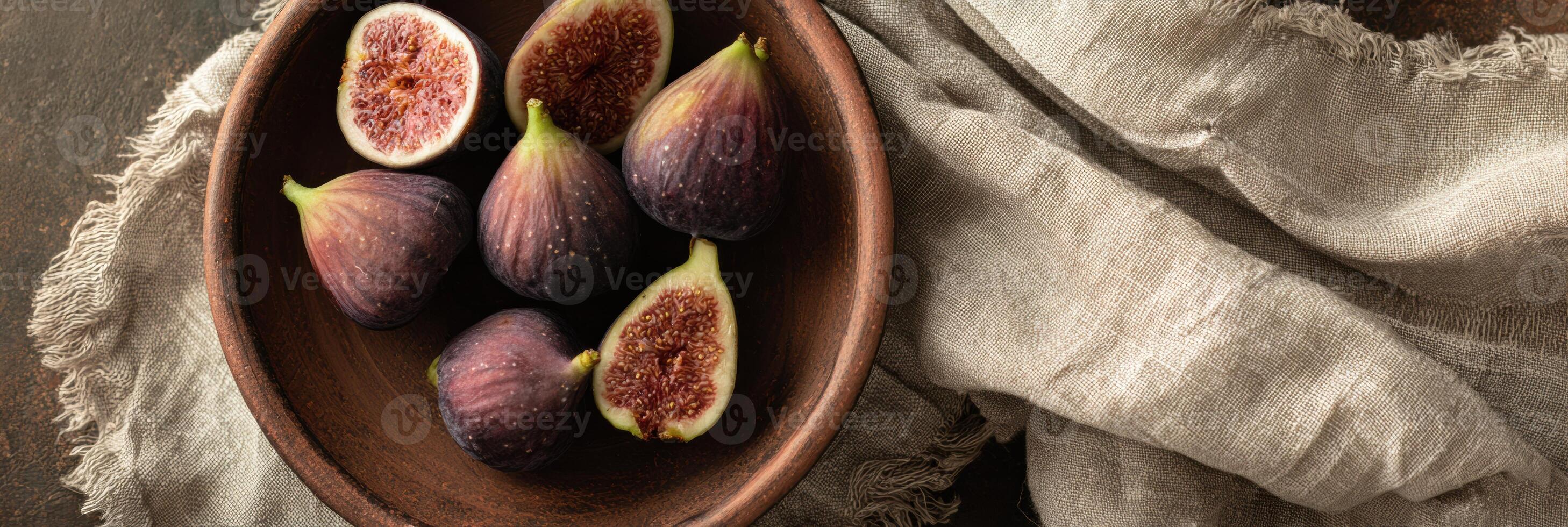 Clay Plate Filled With Fresh Figs on a Rustic Linen Cloth With Space for Text Overlay photo