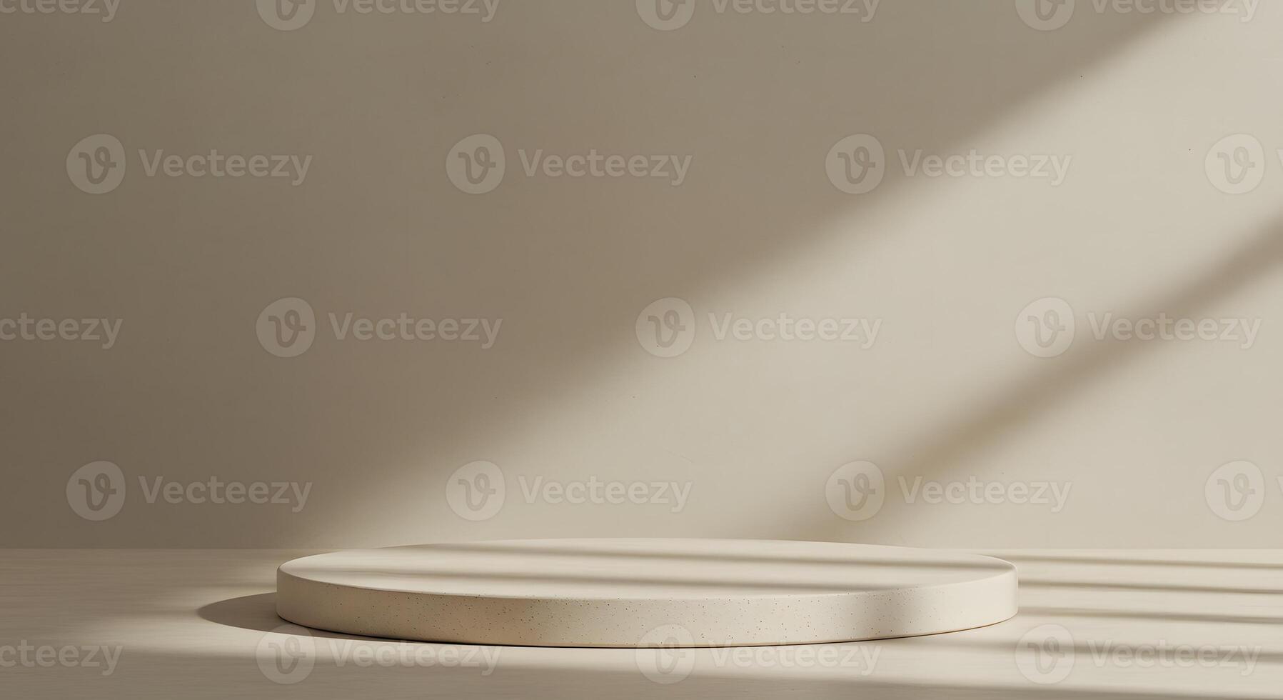 Minimalist beige podium with textured surface and soft natural light casting shadows photo
