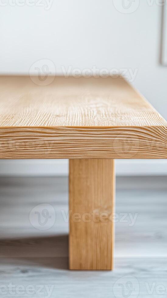 Close-up of a beautifully crafted modern wooden table, showcasing its natural wood grain and elegant minimalist design for contemporary interior spaces. photo