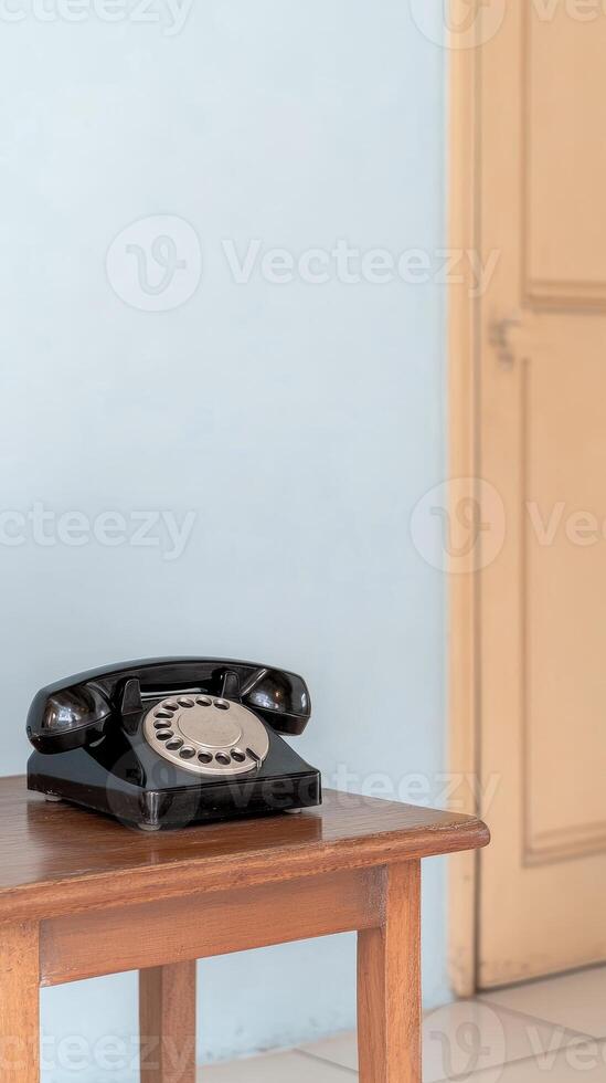 Captivating Vintage Rotary Telephone on a Rustic Wooden Table, Evoking Nostalgia for Classic Communication and Timeless Home Decor. photo