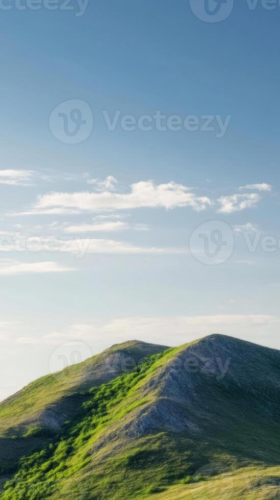 Majestic Verdant Mountains Under a Clear Azure Sky A Serene Natural Landscape Vista with Rolling Hills and Expansive Blue Horizons, Perfect for Tranquil Escapes photo