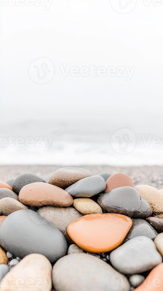 Serene Coastal Pebbles A Close-Up of Smooth, Colorful Beach Stones by the Tranquil Ocean Shoreline, Capturing Nature's Calm Beauty. photo