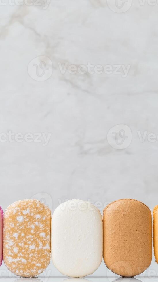 A delightful array of colorful macarons and sweet pastries elegantly displayed against a pristine white marble backdrop, symbolizing gourmet indulgence. photo