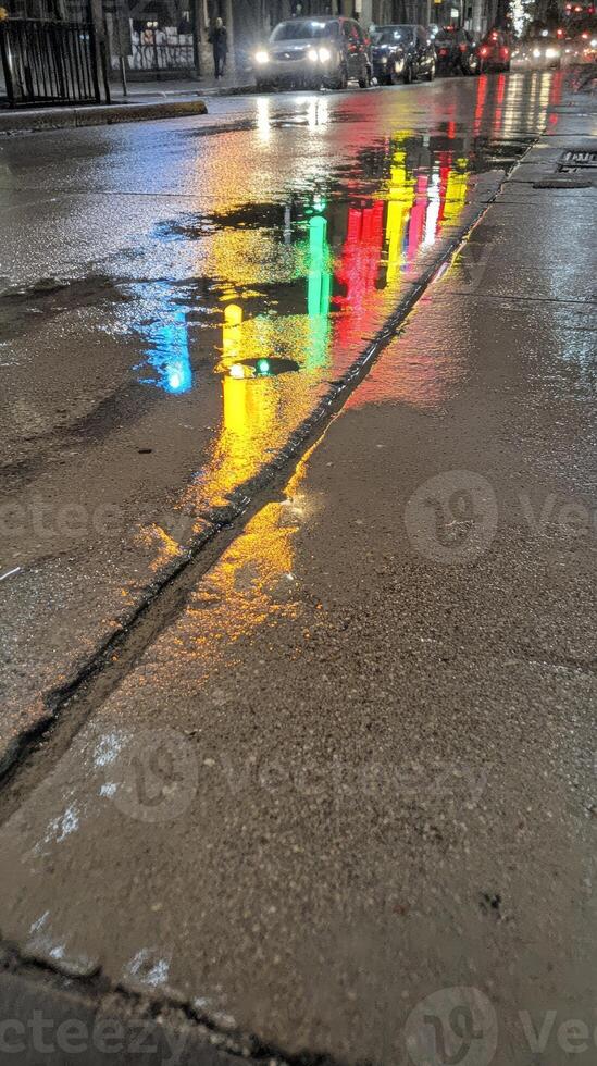 Colorful Urban Reflections Dance on a Wet City Street at Night, Capturing the Luminous Essence of Metropolitan Life After Rain photo