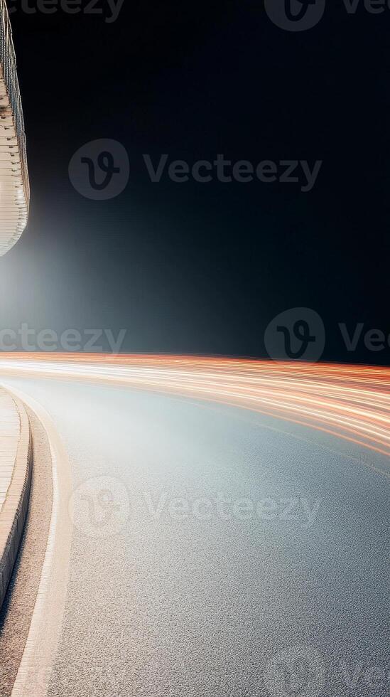 Dynamic urban nightscape with vibrant light trails on a curving road, capturing the essence of modern city movement and architectural flow. photo