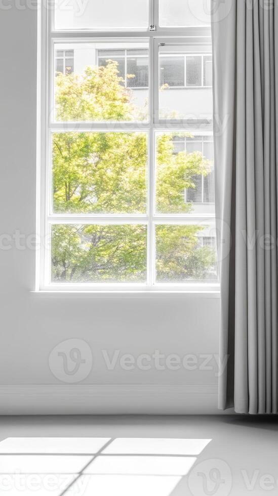 Bright, Modern Interior with Large Window Overlooking Lush Green Trees and Sunlight Streaming into a Minimalist Room, Creating a Serene and Inviting Atmosphere. photo