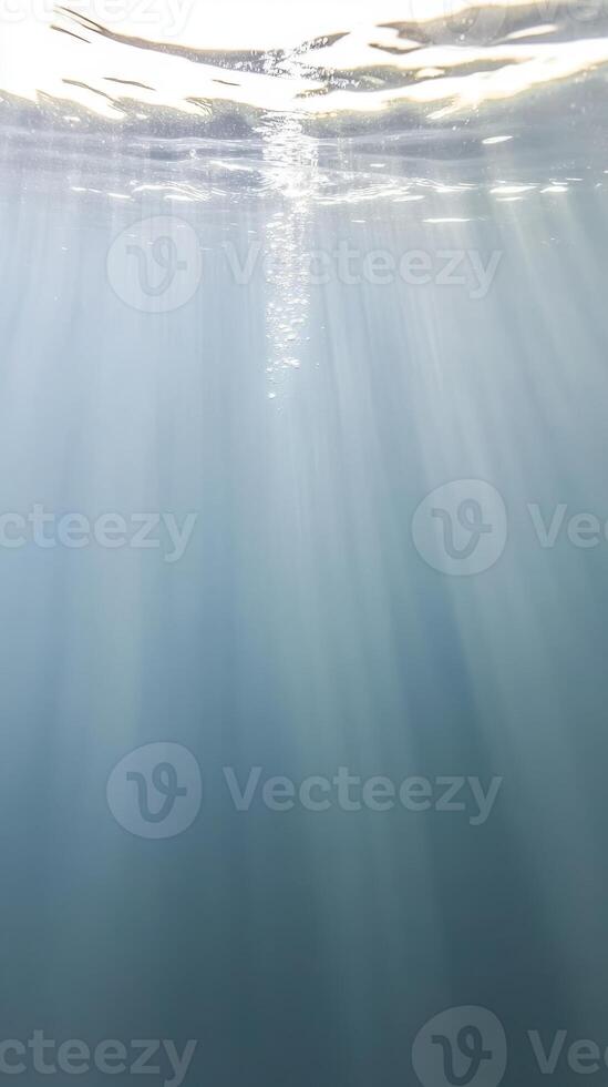 Captivating Underwater Light Rays in Deep Blue Ocean. Tranquil Water Surface, Shimmering Bubbles. Serene Aquatic Background. photo