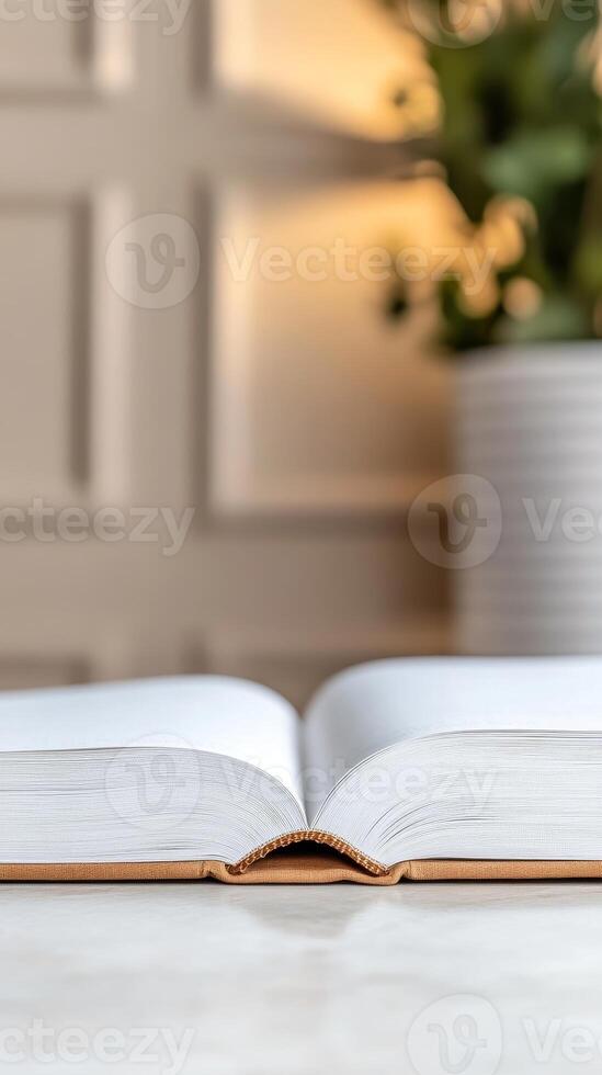Open Book on a Serene Table A Symbol of Knowledge, Learning, and Quiet Contemplation in a Bright, Minimalist Setting photo