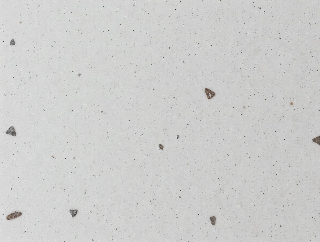Light Gray Textured Background with Small Scattered Triangular Inclusions photo