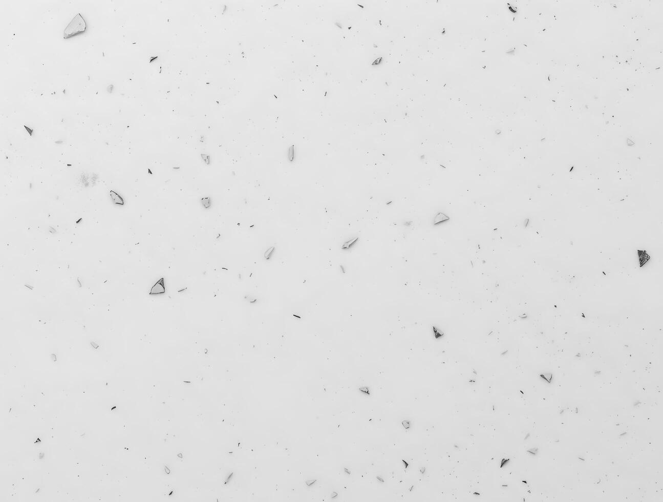 White Background with Scattered Fragments A Textured Design Element photo