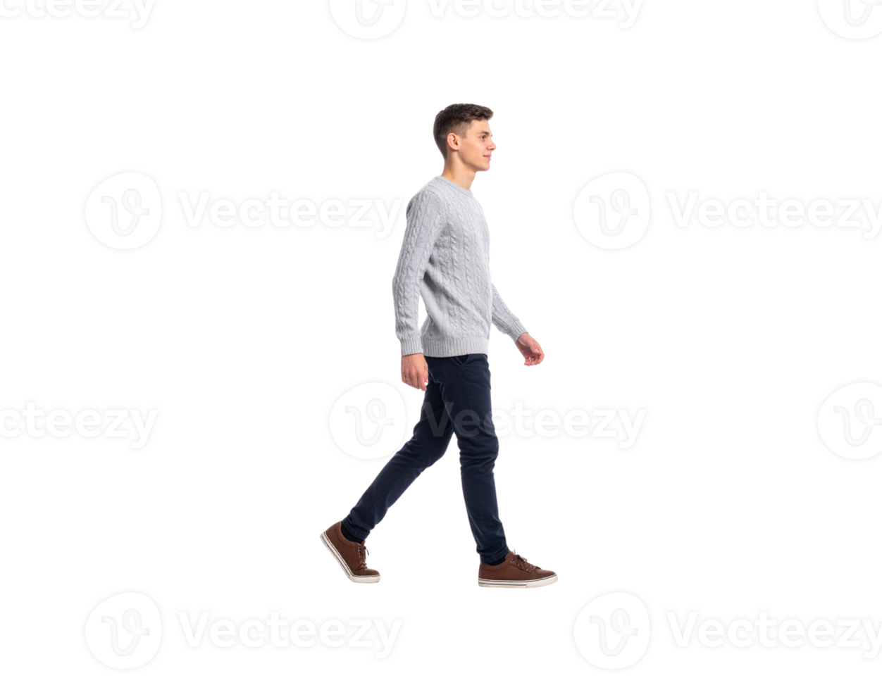 Side profile of a young man in a grey cableknit sweater walking confidently. png