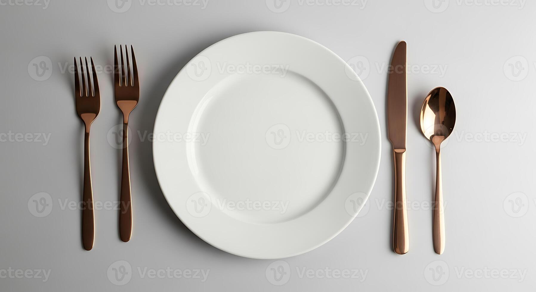 Elegant place setting with copper cutlery and white plate photo
