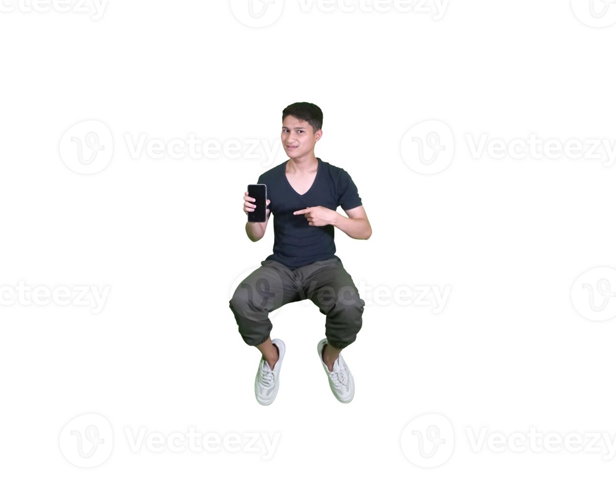 A young man dressed casually in a squatting pose, showing a promotional app smartphone. png