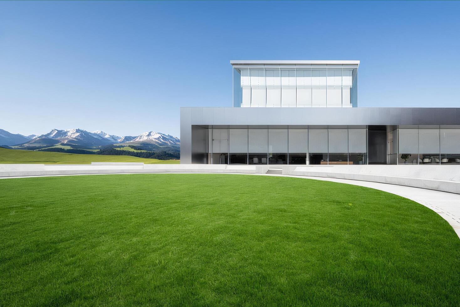 Modern Building with Green Lawn and Mountain View photo