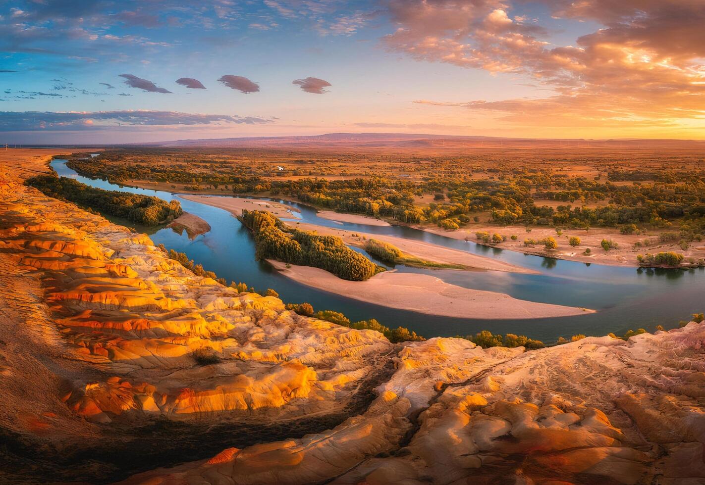 Aerial View of a Meandering River at Sunset in a Desert Canyon photo