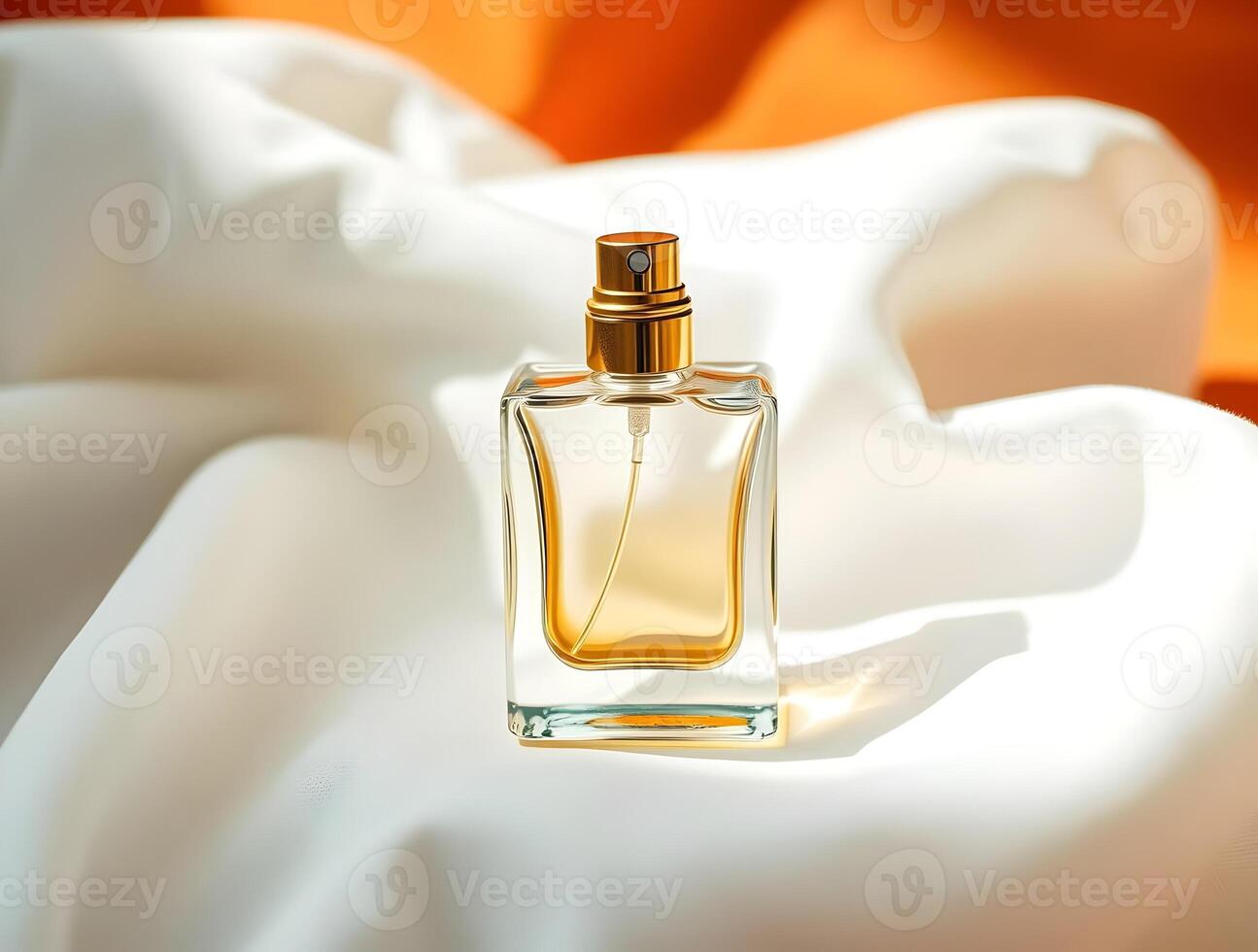 An empty perfume bottle on a white cloth photo