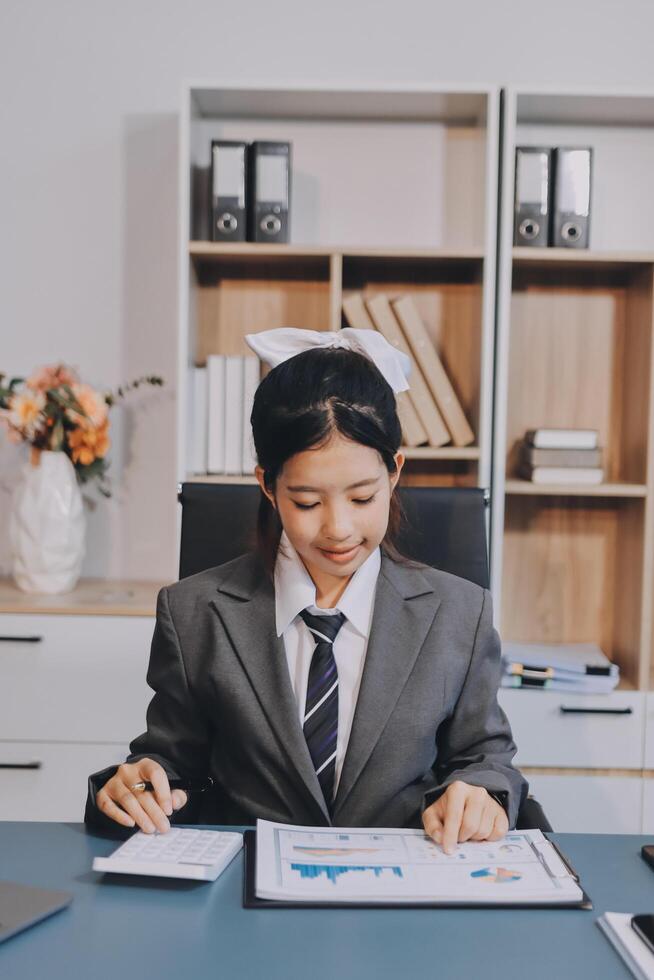 Asian female nurse working in office photo