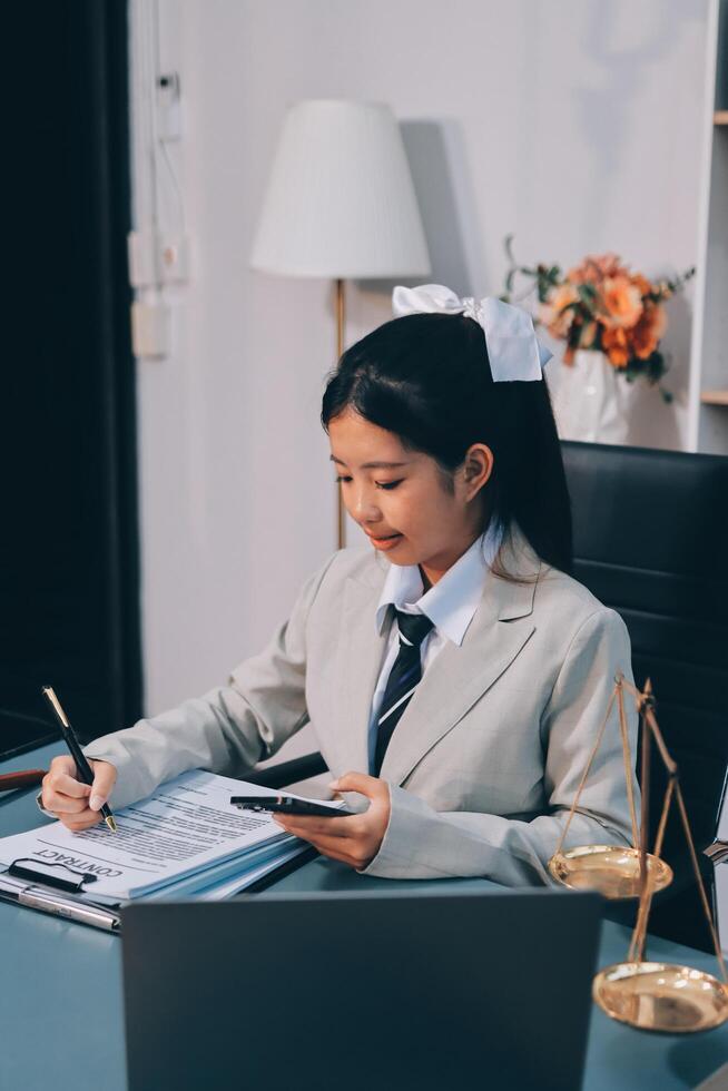 Asian female lawyer working at her desk photo