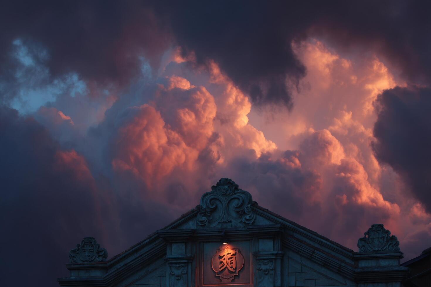 A building with a clock tower in the background is lit up by a red and orange sky photo